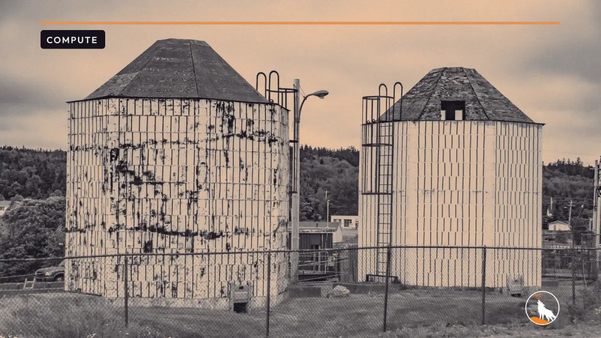 Industrial silos in Port Hawkesbury, Nova Scotia, graded navy and orange, with the wolf mark.