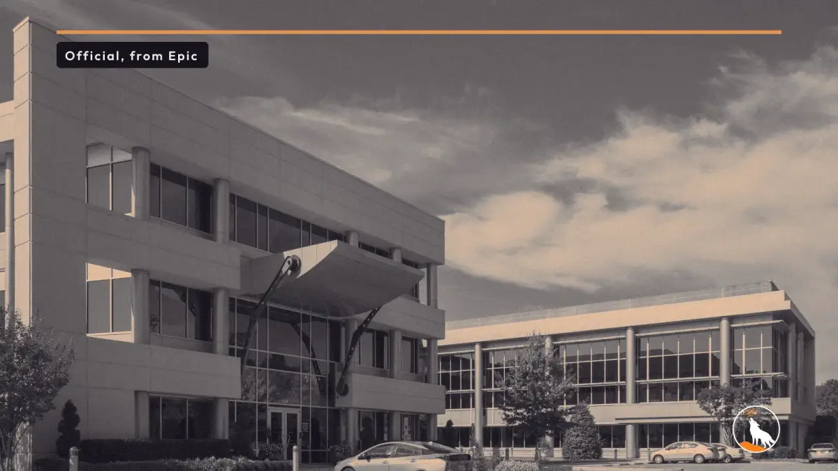 Epic Games' headquarters in Cary, North Carolina, under a blue sky, graded navy and orange, with the wolf mark.